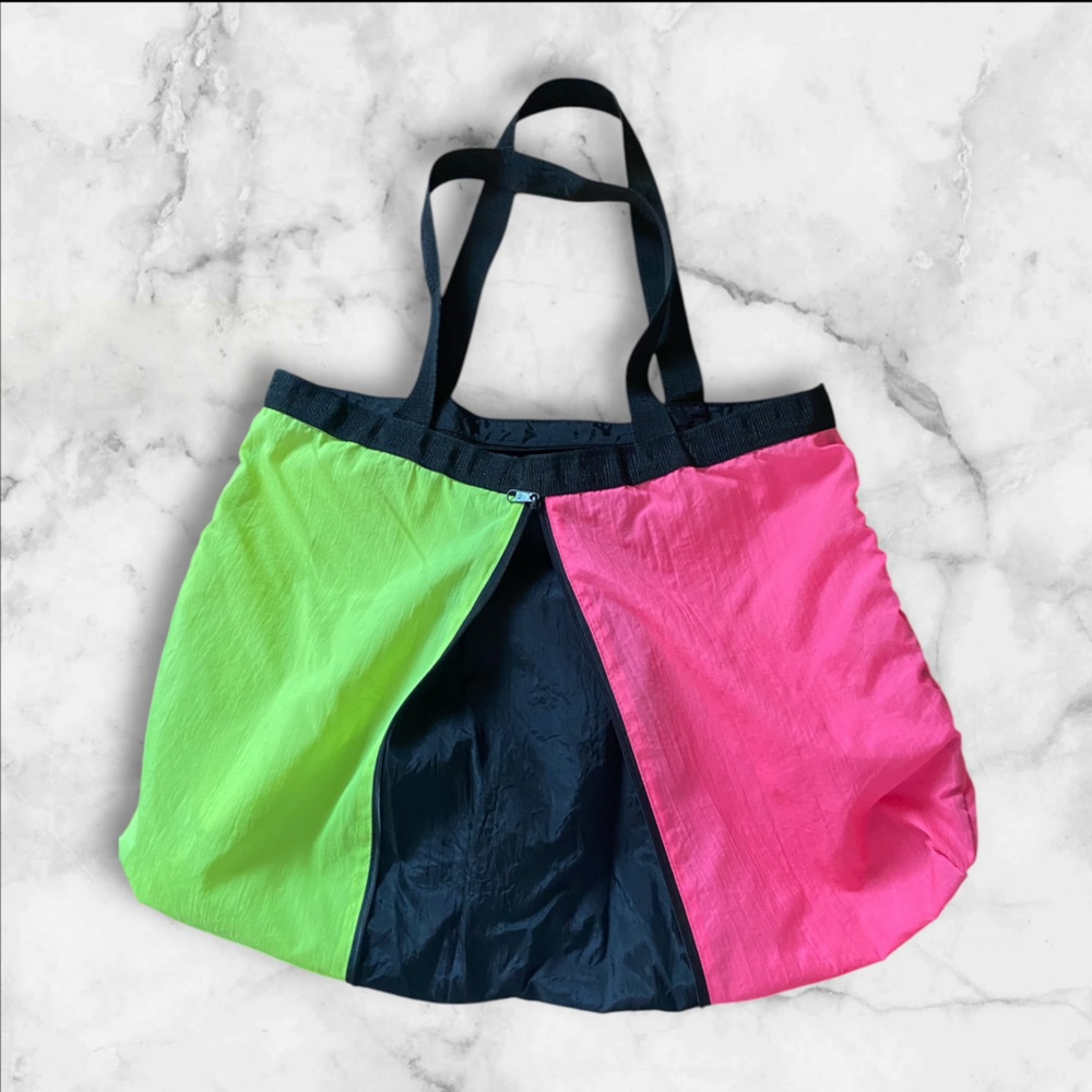 Shane brand multi colored beach bag . Extends